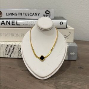 Elegant Gold Necklace with Black Clover Pendant
